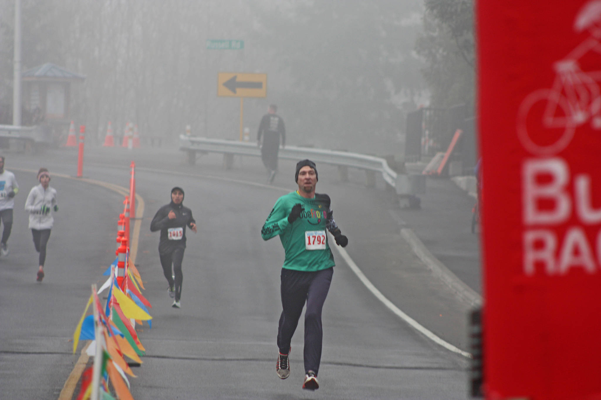Tacoma’s Ben Mangrum sprints to the finish line to win Kent’s 35th annual Christmas Rush Fun Run at Hogan Park at Russell Road on Saturday. Mangrum completed the 10-kilometer (6.2-mile) course in 34 minutes, 13 seconds. MARK KLAAS, Kent Reporter
