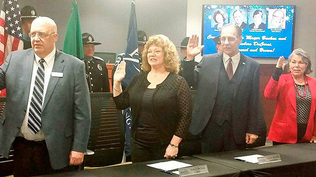 Sworn in on Tuesday are, from left, Councilman Larry Brown, Mayor Nancy Backus and Council members Claude DaCorsi and Yolanda Trout-Manuel. ROBERT WHALE, Auburn Reporter