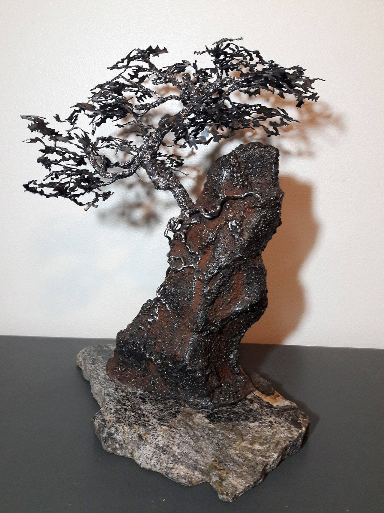 Wendy Ray’s welded steel and granite creation, a growing tree titled Rocky Solitude, is out of repurposed materials and part of the CVG Show in Bremerton this month. COURTESY PHOTO, Wendy Ray