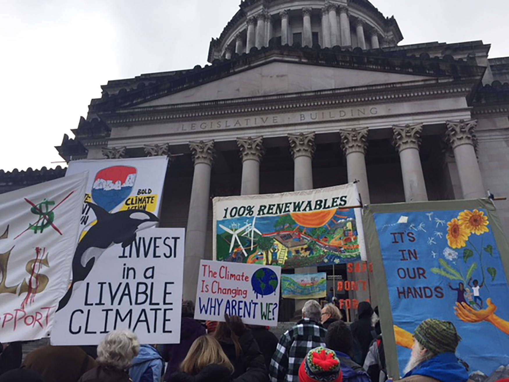 Climate groups gather on the steps of the Capitol building on Monday, demanding the government uphold treaty rights, habitat and the environment. COURTESY PHOTO, WNPA Olympia News Bureau