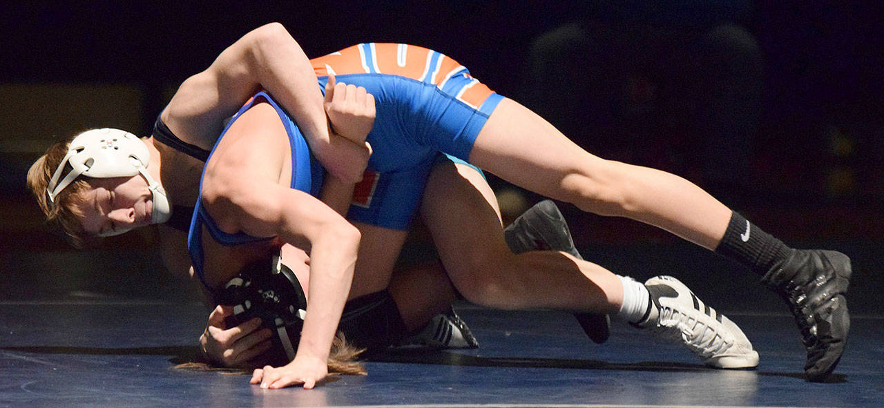 Auburn Riverside’s Jaden Cassel rides Auburn Mountainview’s Jager Woods during their 113-pound match Thursday at Auburn Riverside High School. Cassel, a state placer last season, dominated and pinned his opponent in 2:40. RACHEL CIAMPI, Auburn Reporter