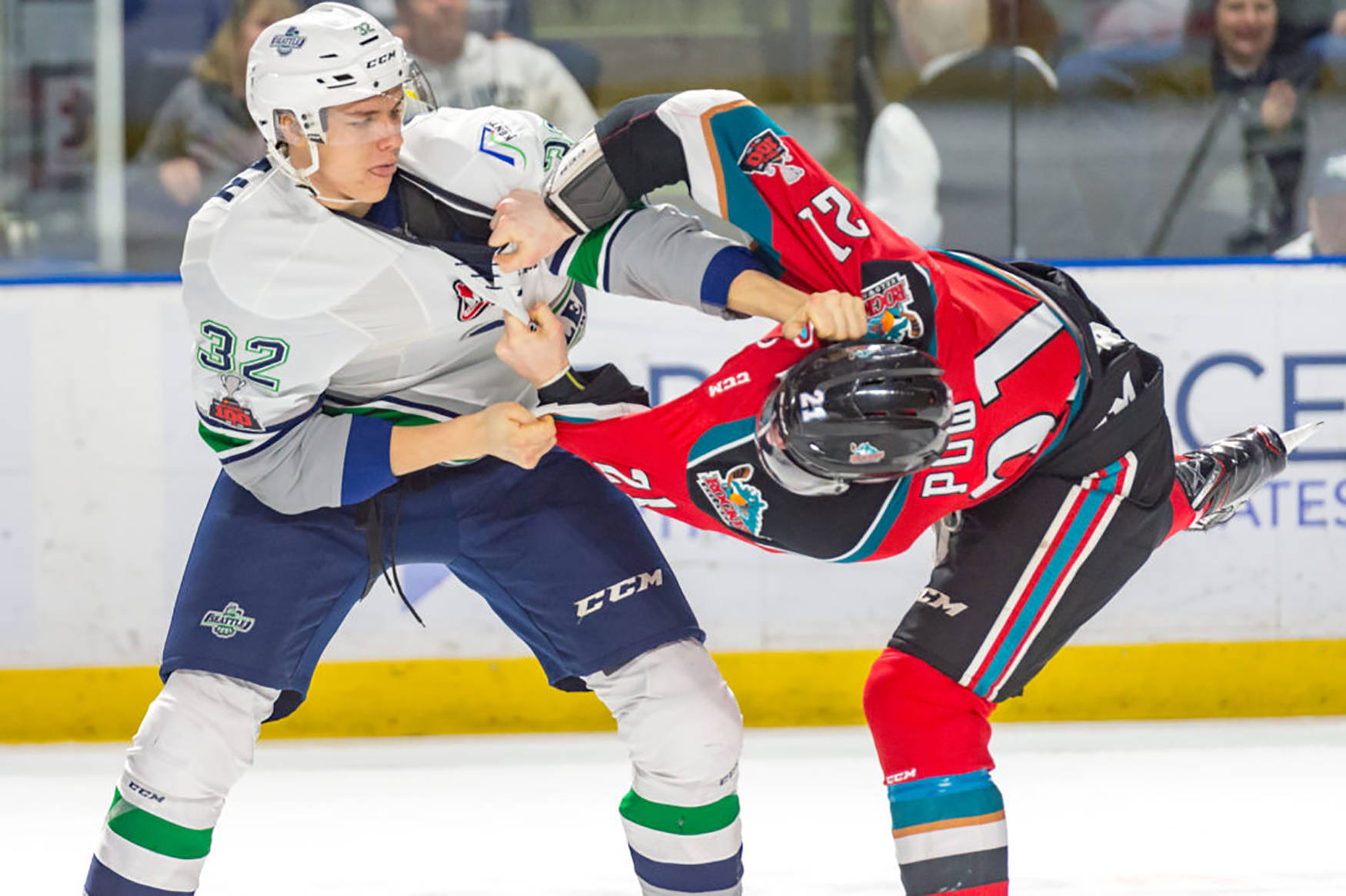 The Thunderbirds’ Mike MacLean, left, scuffles with the Rockets’ Kyle Pow during WHL play Friday night at the accesso ShoWare Center. COURTESY PHOTO, Brian Liesse/T-Birds