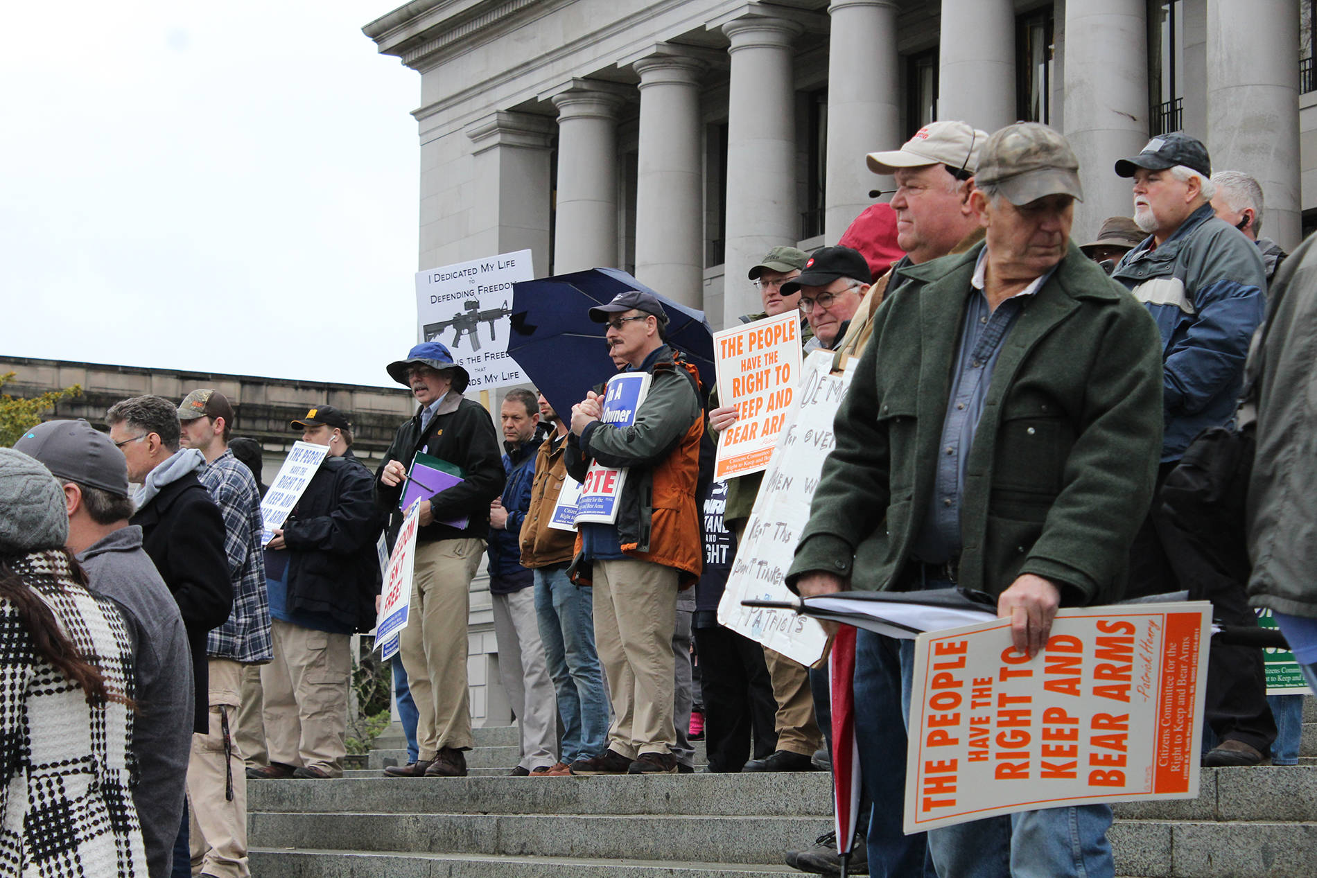 Gun rights supporters gather on the steps of the Capitol building for a rally on Friday. Taylor McAvoy/WNPA Olympia News Bureau