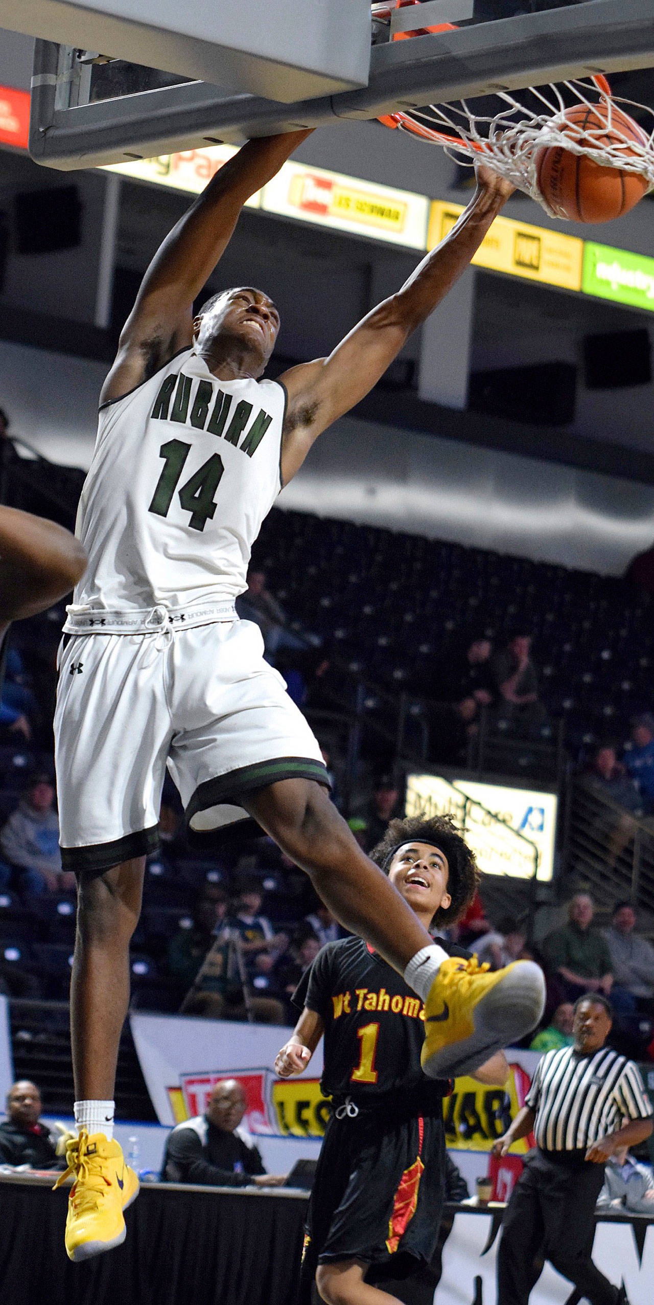 Auburn’s Isaiah Dunn throws down a jam during third-quarter action in the King Showcase at the ShoWare Center on Monday. Dunn finished with 11 points and 10 rebounds in the Trojans’ 80-37 rout of Mount Tahoma. RACHEL CIAMPI, Auburn Reporter