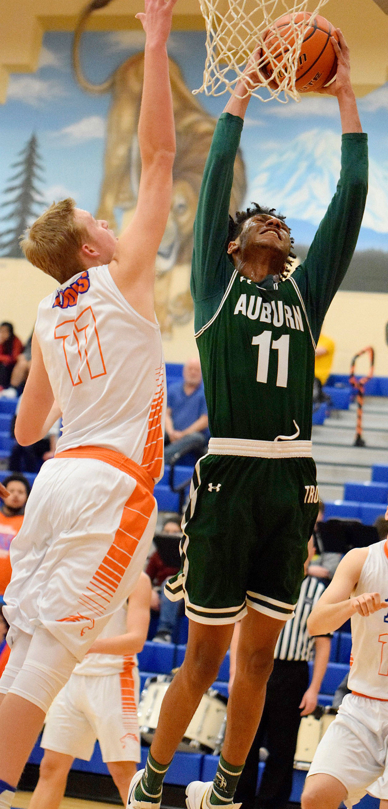 Auburn’s Sidney White grabs a rebound away from Auburn Mountainview’s Quinn Lacey during NPSL play Tuesday night. RACHEL CIAMPI, Auburn Reporter