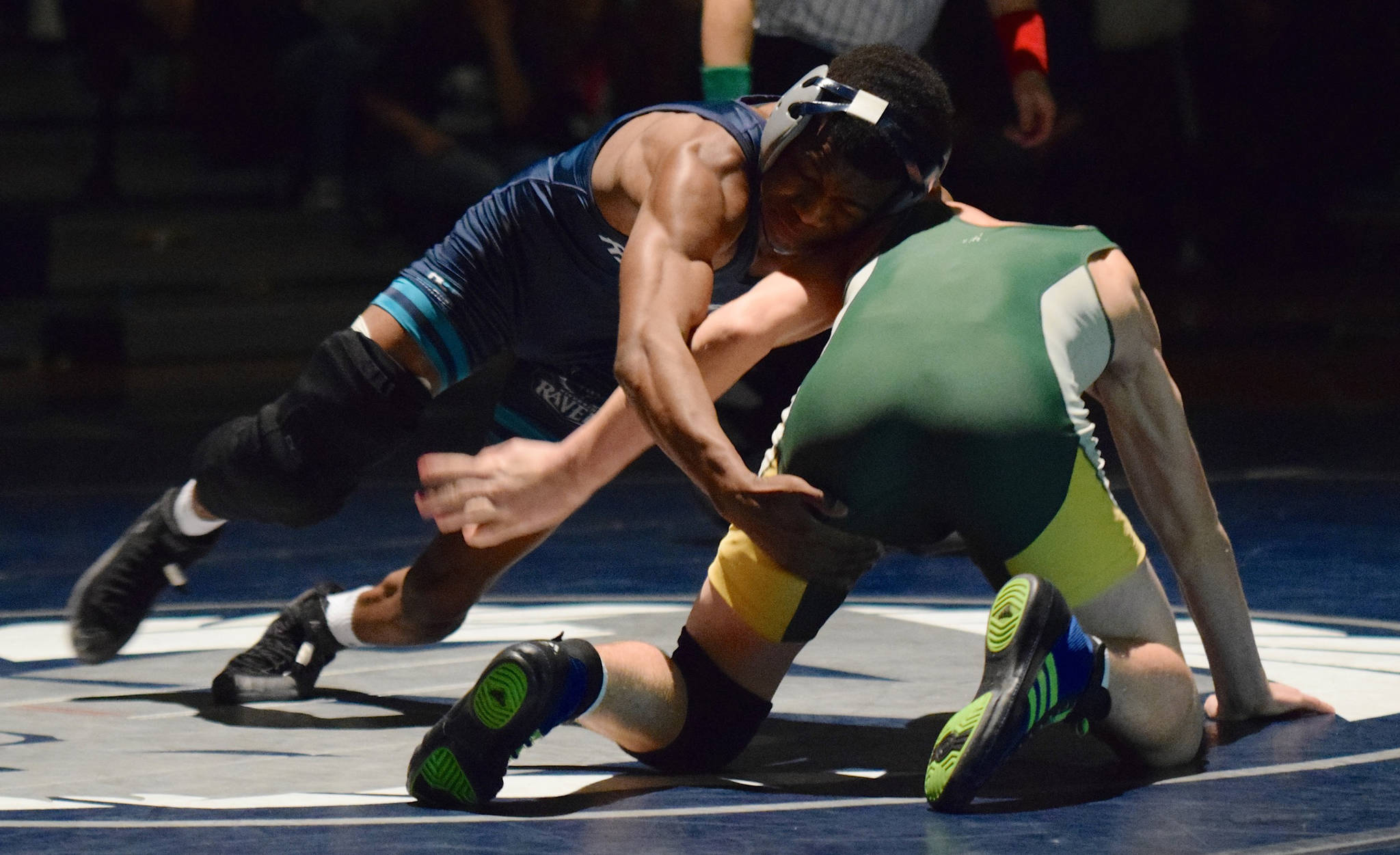Auburn Riverside’s state-class Yusef Nelson maneuvers around Auburn’s Quinton Weddle during their 120-pound bout Wednesday night. Nelson won by first-round fall. RACHEL CIAMPI, Auburn Reporter