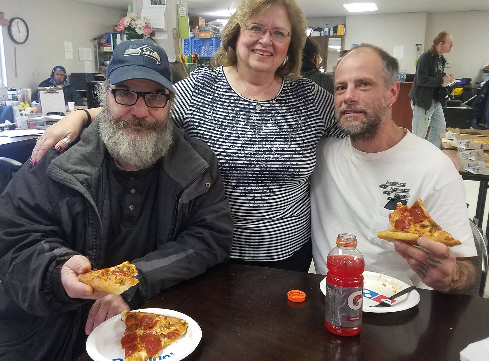 Debbie Christian, executive director of the Auburn Food Bank that runs the day shelter, joins Robin, left, and Dane for lunch. COURTESY PHOTO