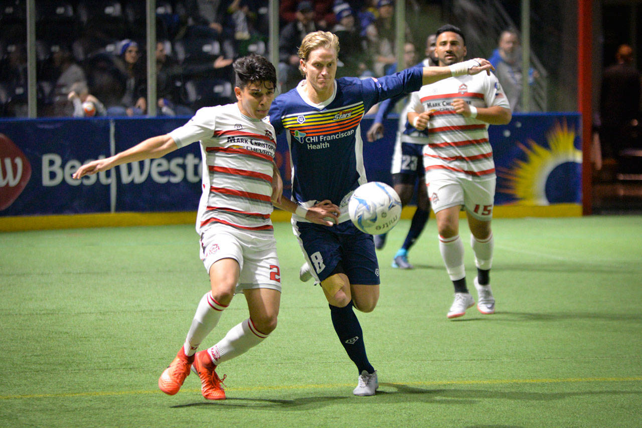The Stars’ Philip Lund, right, battles the Fury’s Maicon De Abreu during MASL action earlier this season. COURTESY PHOTO, Stars