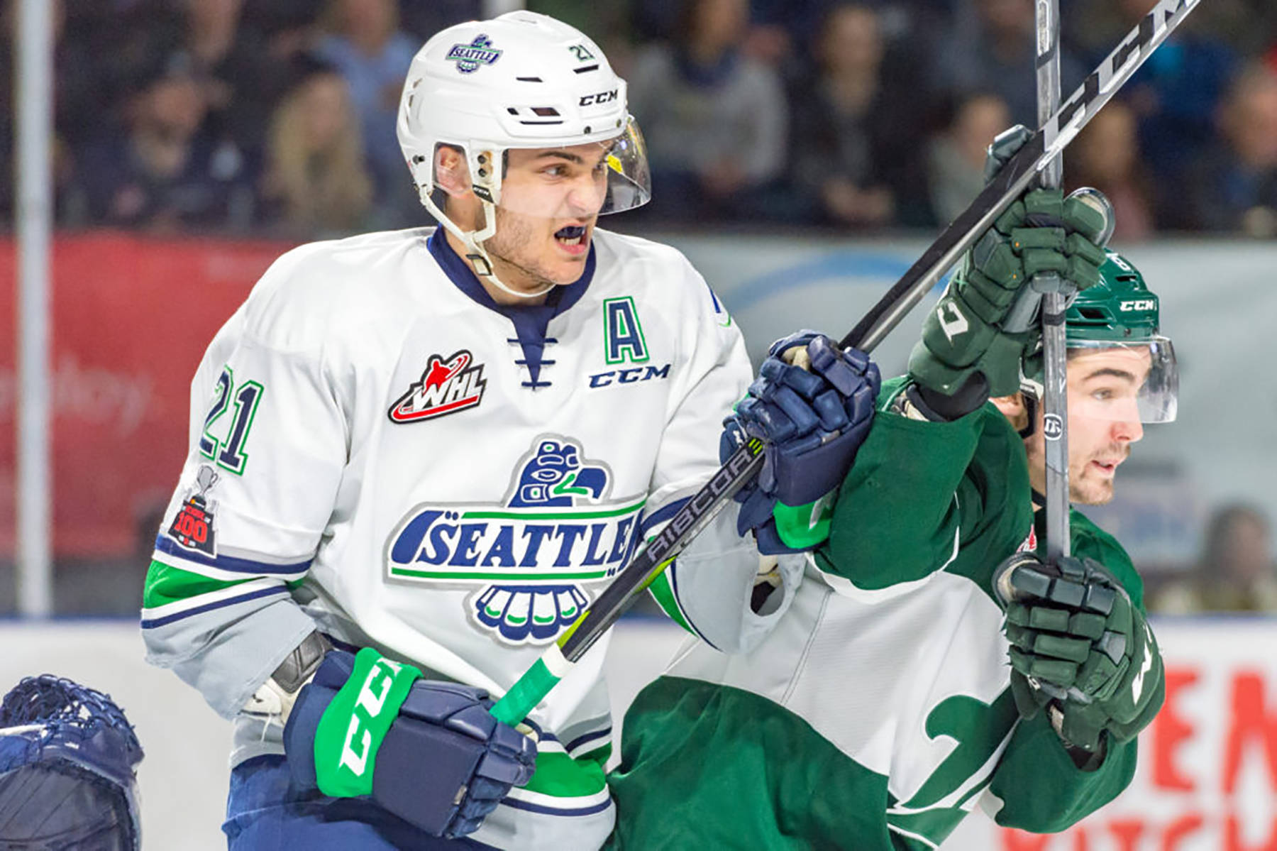 Thunderbirds center Matthew Wedman, left, battles a Silvertip for position during WHL play Saturday night. COURTESY PHOTO, Brian Liesse, T-Birds