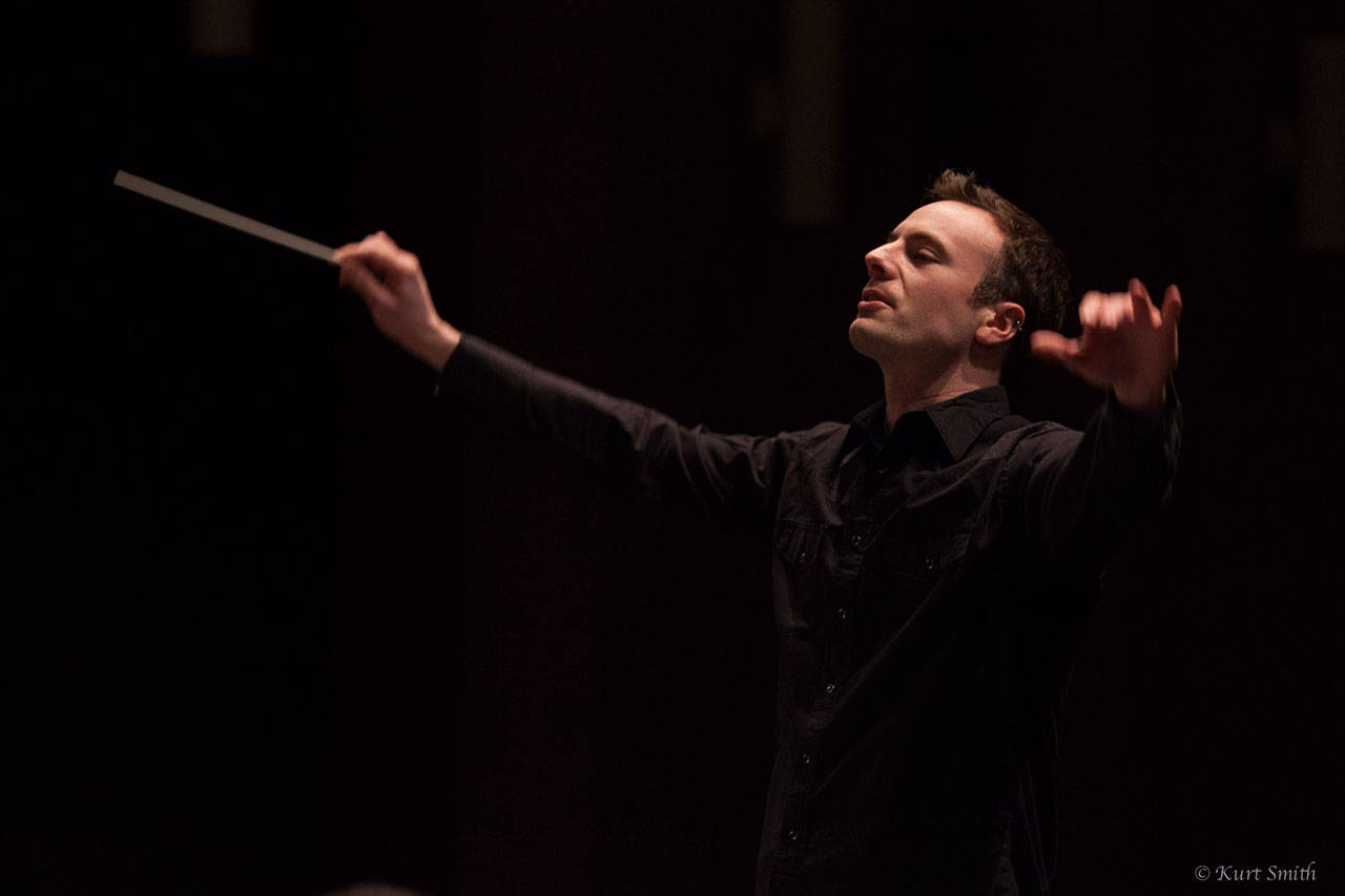 Doing what he does best: Wesley Schulz, 34, brings extensive national and international experience to his new role, conductor of the Auburn Symphony Orchestra. Schulz, who succeeds the retired Stewart Kershaw, was chosen after a long and careful search. COURTESY PHOTO, Kurt Smith
