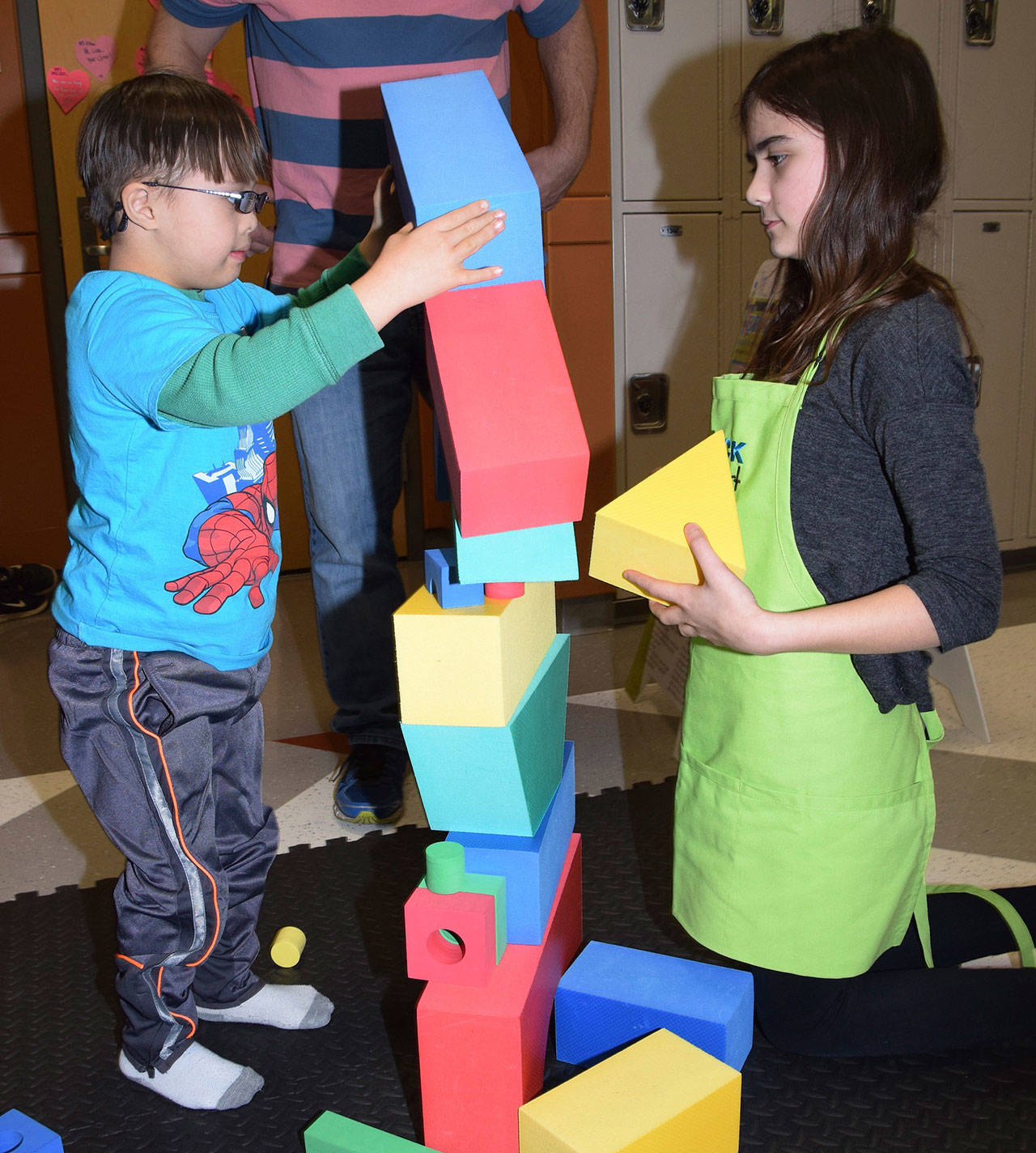 Kenna Marshall, of Block Fest, has Max Froman, 6, assemble a block tower during the Auburn School District’s 12th annual Early Learning Fair in the Auburn High School Commons on Monday. RACHEL CIAMPI, Auburn Reporter