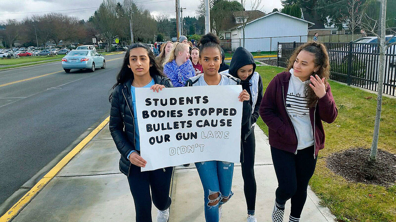 Japnoor Sandhu, top left, and Asia Bol, top right, freshman at Auburn Mountainview High School, joined Wednesday’s nationwide student walkout and march they said, because they want schools to be what they should be: places to learn, not places to be shot. ROBERT WHALE, Auburn Reporter