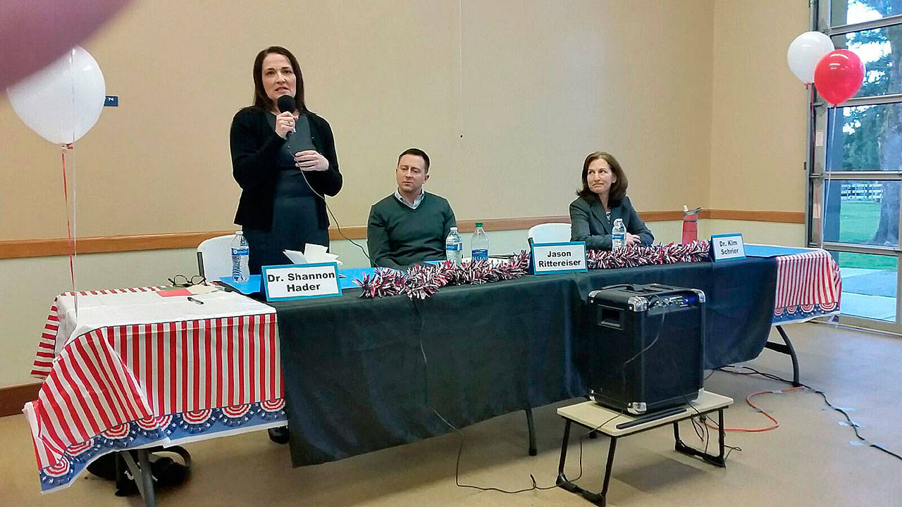 Dr. Shannon Hader, a candidate for the 8th Congressional District seat, fields a question as her opponents, Jason Rittereiser and Kim Schrier, look on during their forum in Auburn on March 16. ROBERT WHALE, Auburn Reporter