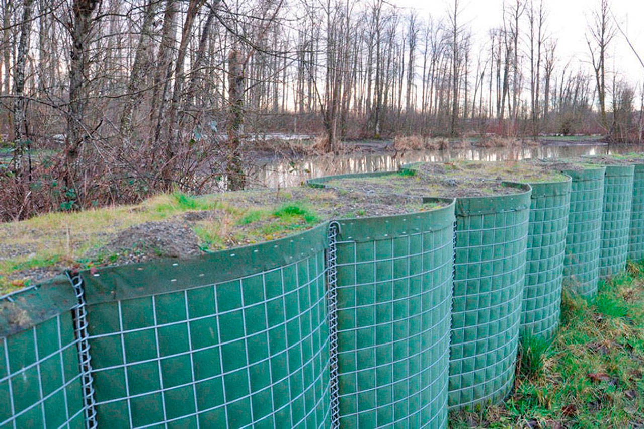 As the region transitions from winter’s heightened threat of flooding to milder spring weather, temporary flood protection barriers along a park in Pacific will soon be removed. REPORTER FILE PHOTO