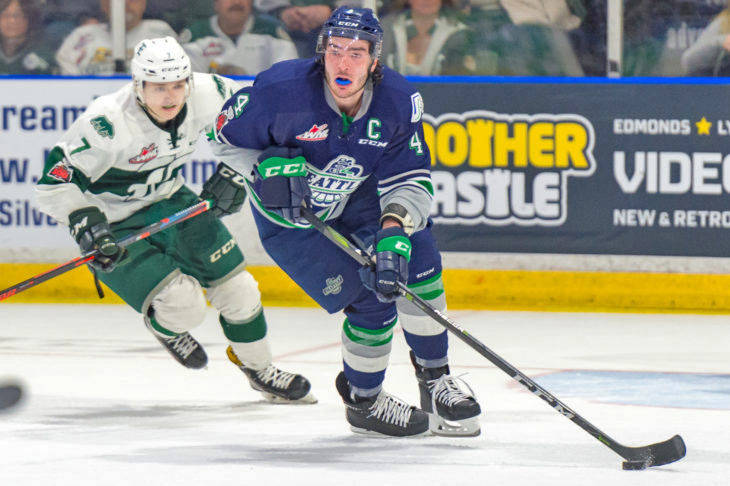 The Thunderbirds’ Turner Ottenbreit brings the puck up the ice with the Silvertips’ Martin Fasko-Rudas in pursuit during Game 5 play Saturday night. COURTESY PHOTO, Brian Liesse, T-Birds