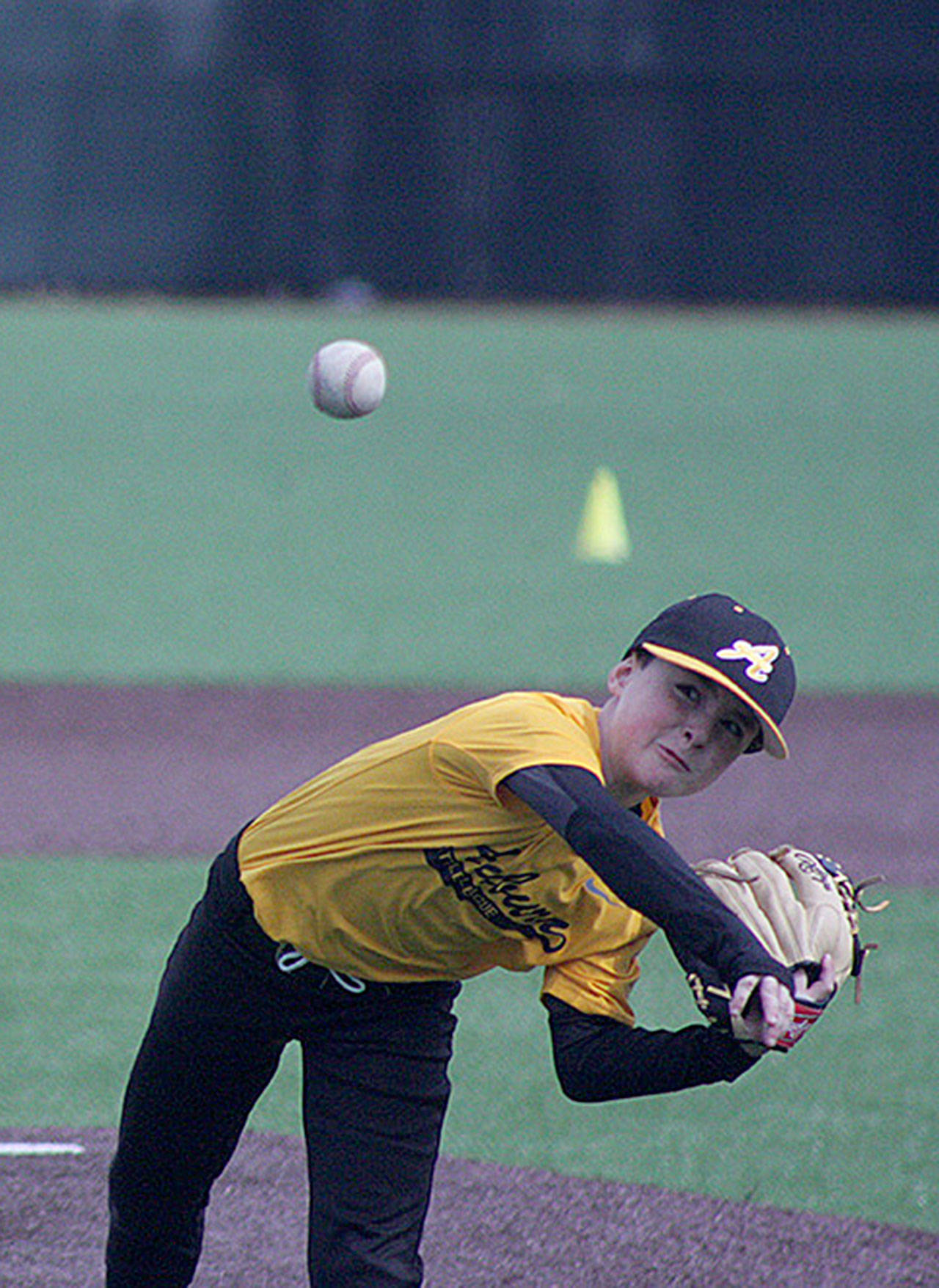 Burton Herndon delivers a pitch for the Auburn Little League’s Savage Sluggers during their AA Division game against the Destroyers at the Auburn High School varsity field last Saturday. The game between the 9-year-olds was among the many on opening day. MARK KLAAS, Auburn Reporter