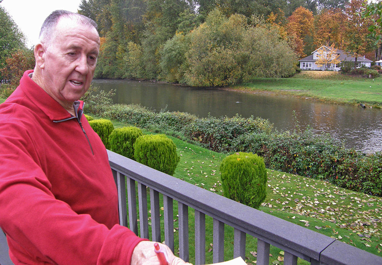 James Fugate, former superintendent of Auburn schools, looks on in the back yard of his Auburn home, on the east bank of the Green River. REPORTER FILE PHOTO 2009, Robert Whale