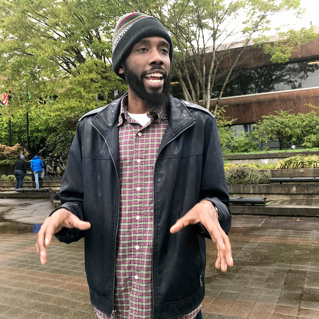 Marquese Averett, senior organizer for the South King County office of Fuse, a statewide, progressive advocacy organization, talks at the rally. MARK KLAAS, Auburn Reporter