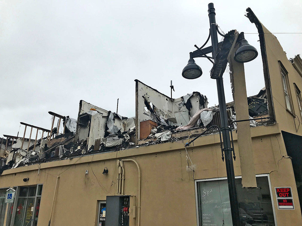 The Heritage Building on East Main Street burned Dec. 26, leaving its owner, Melina Lin, with a complex passel of problems to solve and possibilities to ponder. ROBERT WHALE, Auburn Reporter