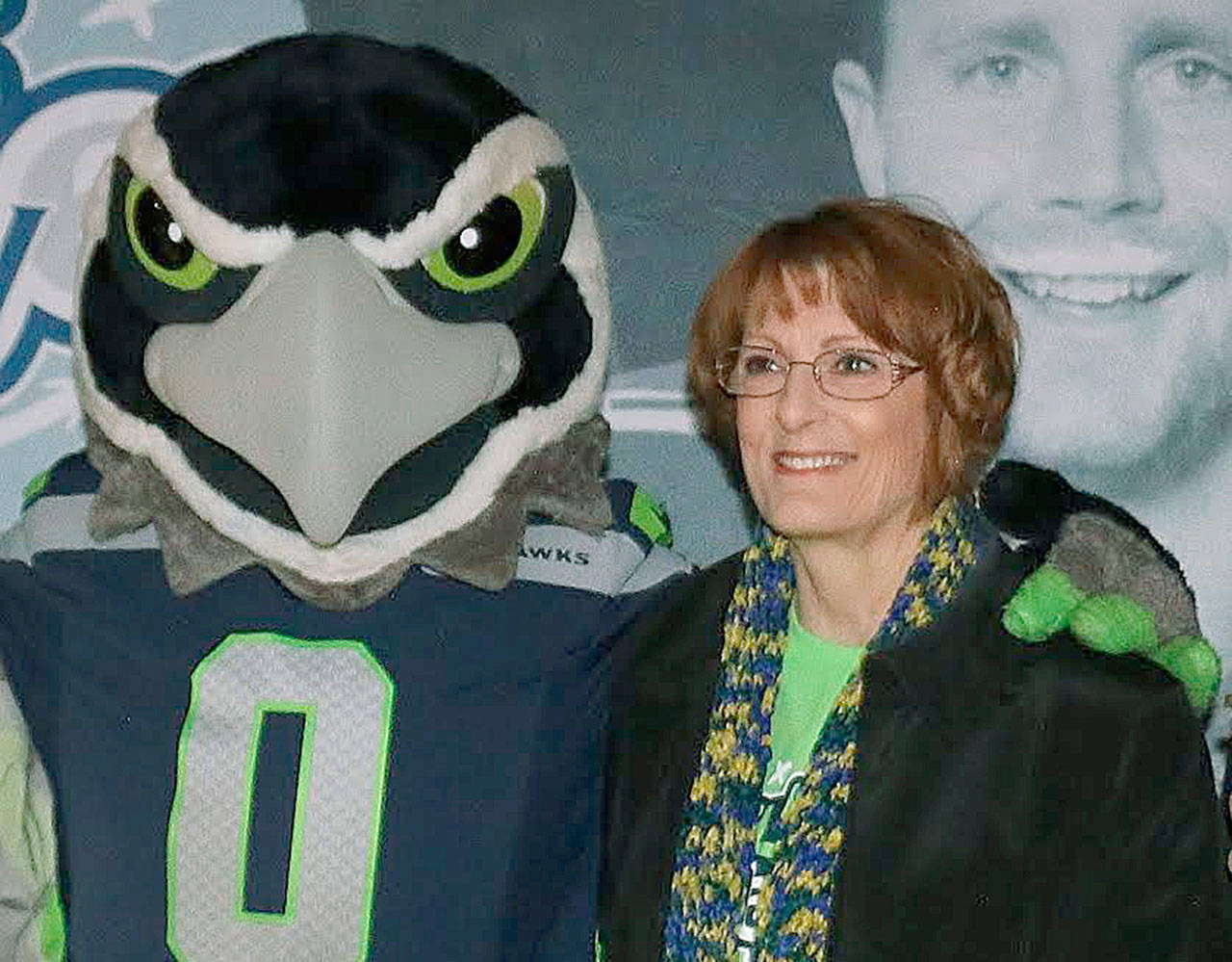 Carol Barker, child nutrition director for the Auburn School District, with Seahawks mascot Blitz at a recent Fuel Up for 60 program visit. COURTESY PHOTO