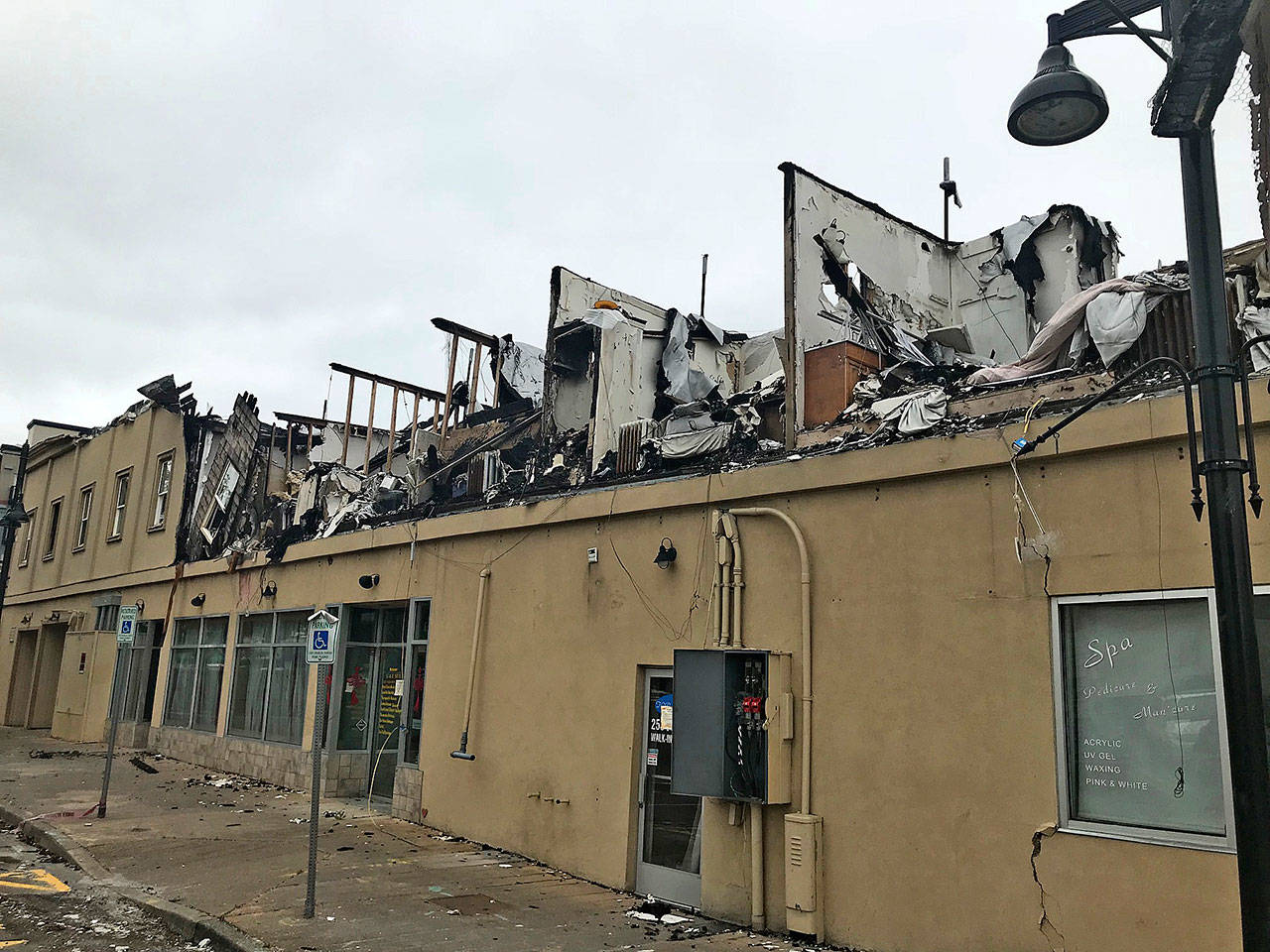 The nearly 100-year-old Heritage Building in downtown Auburn, victim of a devastating fire on Dec. 26, 2017, will come down, possibly within weeks, depending on the city’s issuance of demolition permits. Its owner has already listed the property for sale. MARK KLAAS, Kent Reporter