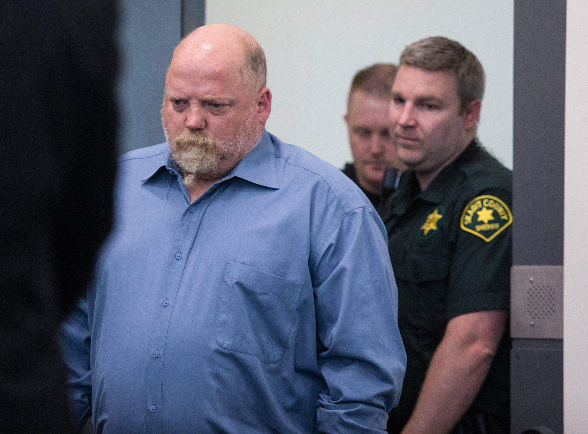 William Earl Talbott II, 55, of SeaTac, is led into court for arraignment in the 1987 death of Tanya Van Cuylenborg at the Skagit County Community Justice Center on Friday in Mount Vernon. (Andy Bronson / The Herald)