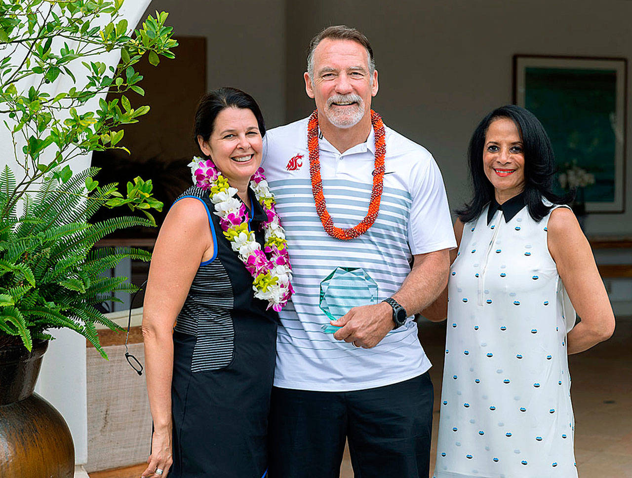 Ron and Lorianne Claudon after the Auburn man received the Robert P. Mallon Dealer of the Year award. Far right is WSADA Executive Vice President Vicki Giles Fabré. COURTESY PHOTO