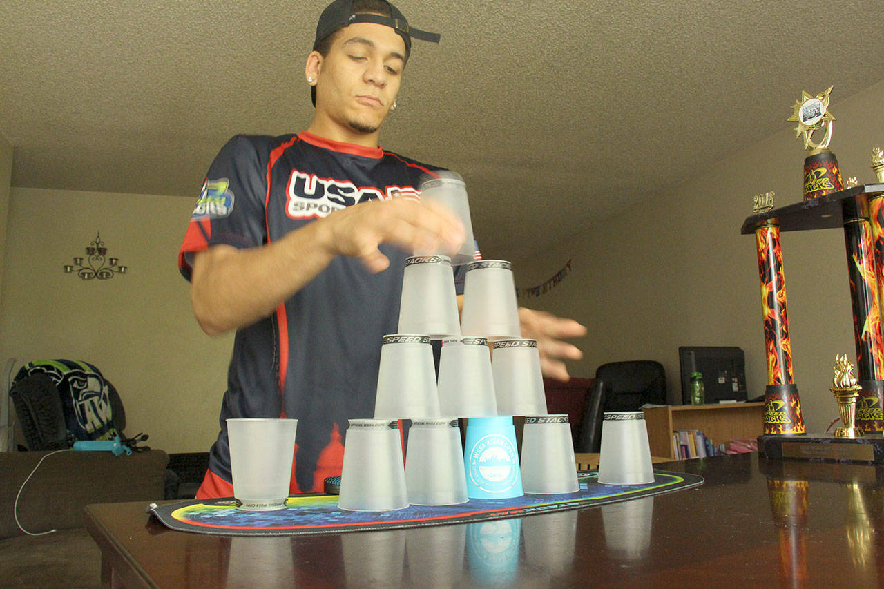 Ezekiel McDowell cycles through one of the stacks that earned him first place at a regional cup-stacking championship in the Northwest. Courtesy Max Wasserman