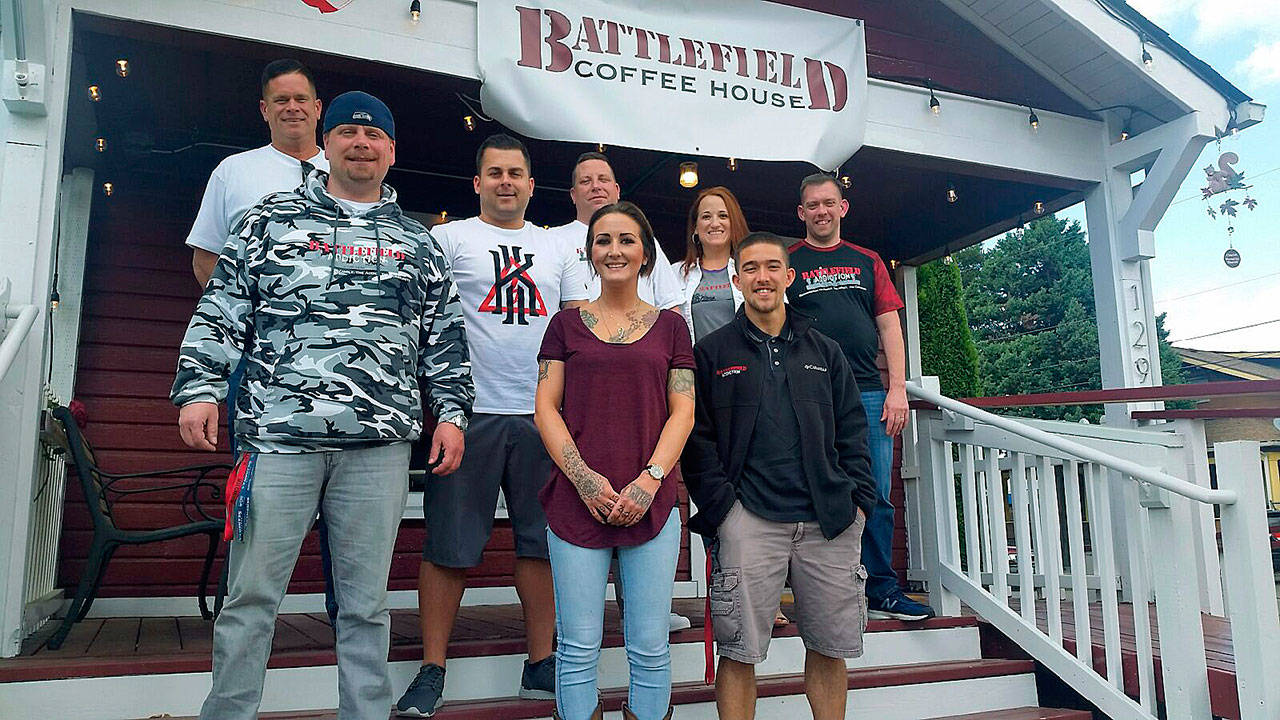 Eager to help addicts and their families turn back addiction at Battlefield Coffee House in Auburn are, back row, from left, managers Adam Day and Korby Ercanerack, co-founder Art Dahlen, co-founder Angie Keaty and her husband, Tim Keaty. Front row, from left, are managers Jason Churchill, Emily Swanson and Kevin Chang. ROBERT WHALE, Auburn Reporter