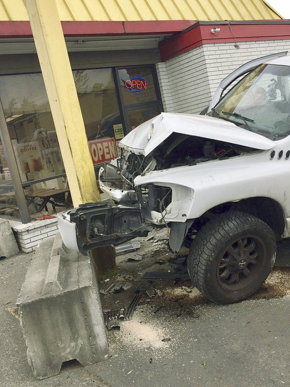 Two customers escaped injury when a speeding, suspected drunk driver plowed his pickup truck into an Auburn doughnut shop Friday morning. COURTESY PHOTO, Auburn Police