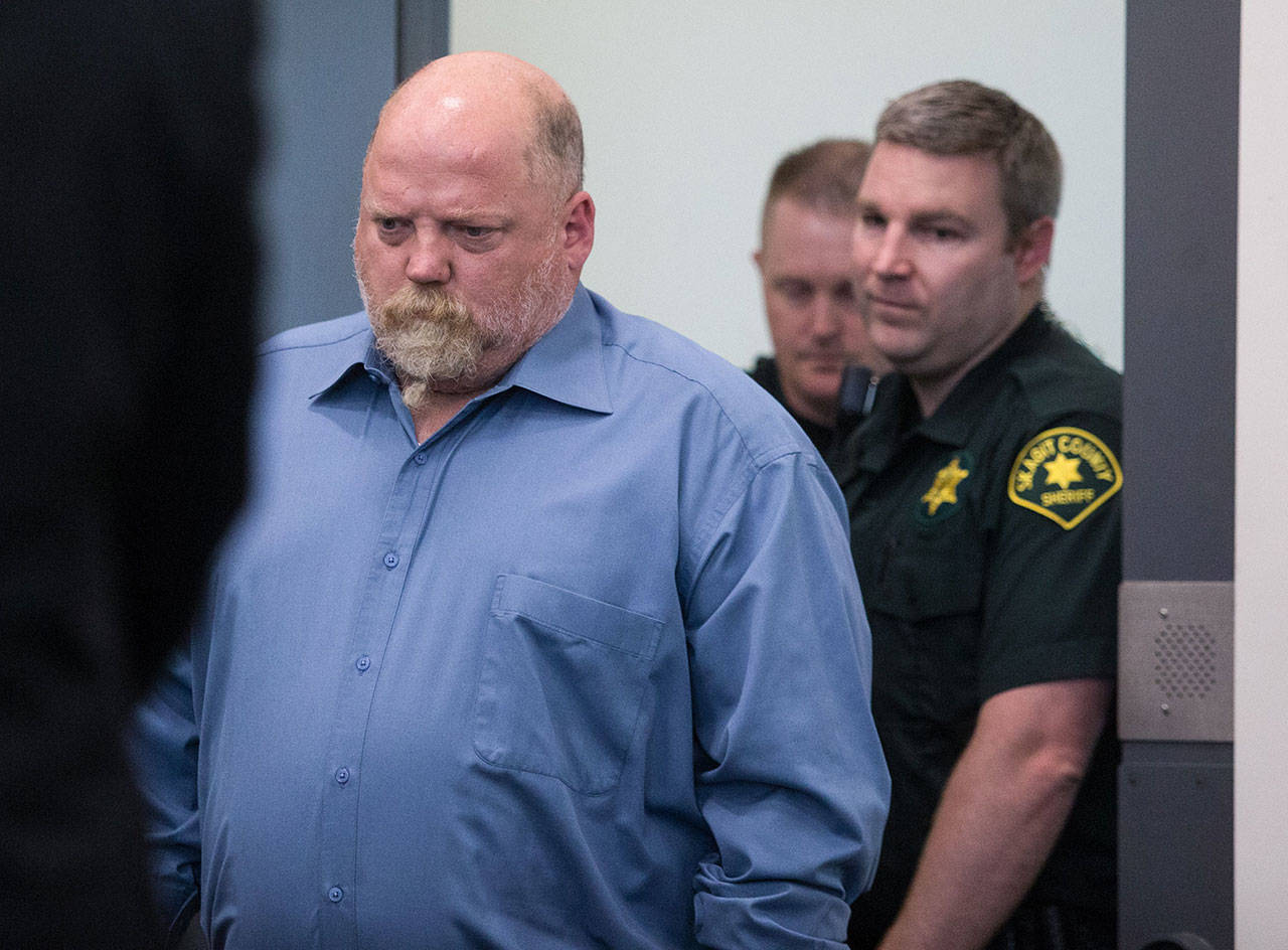 William Earl Talbott II, 55, of SeaTac, is led into court, on arraignment in the death of Tanya Van Cuylenborg in 1987, at the Skagit County Community Justice Center on May 18 in Mount Vernon. (Andy Bronson / The Herald)