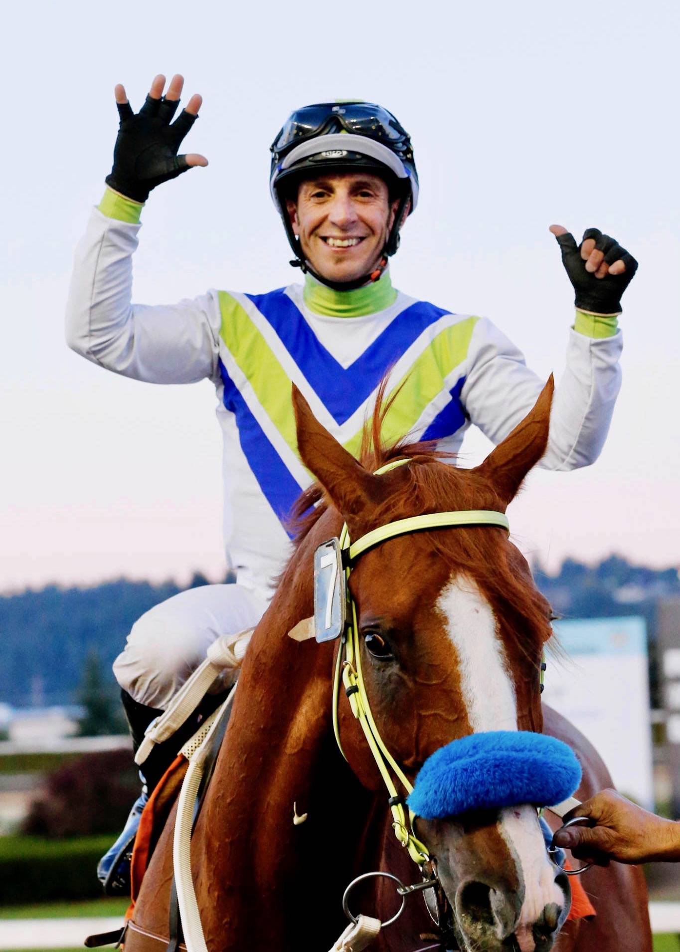 Julien Couton celebrates after riding Blackford to victory – his sixth win of the day – in the ninth race finale Tuesday at Emerald Downs. Couton won despite riding with a broken toe sustained in the final race. COURTESY TRACK PHOTO