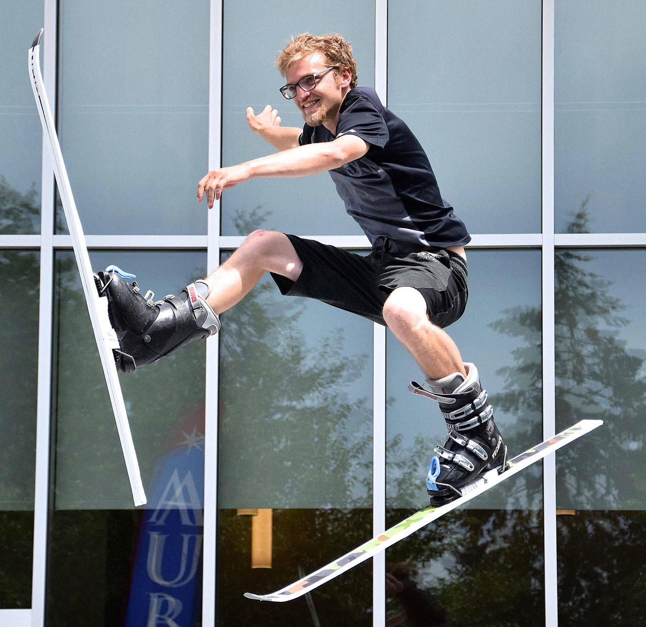 Michael Davidson performs jump ski tricks on the trampoline for the Aerial Assault Flippen Out Show during the Fourth of July Festival at Les Gove Park. RACHEL CIAMPI, Auburn Reporter