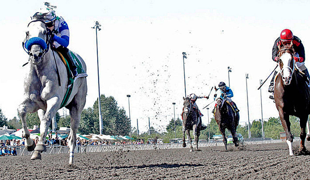 Riser, left, holds off Barkley, far right, in the Mt. Rainier Stakes last Sunday at Emerald Downs in Auburn. COURTESY PHOTO, Emerald Downs