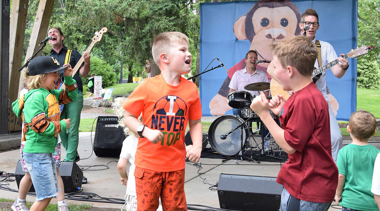 Recess Monkey performs on stage as children dance during a July 18 performance at Les Gove Park. The Kids Summerstage outdoor concert series comes to the park at noon Wednesdays through Aug. 15. RACHEL CIAMPI, Auburn Reporter