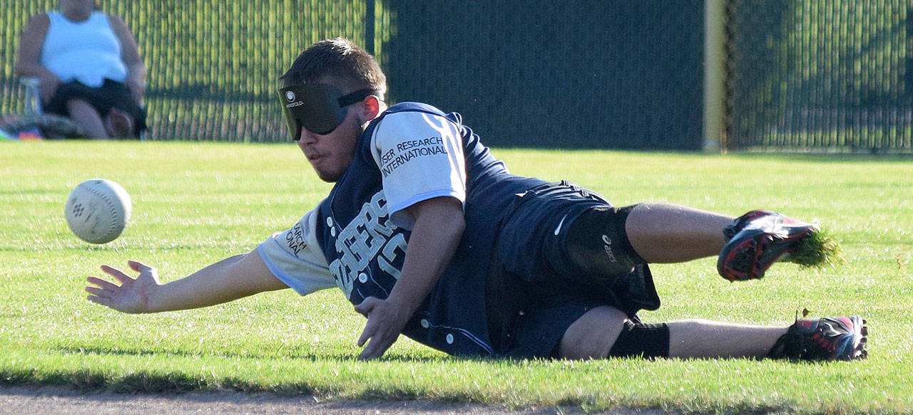 Dylan Pleasants from Seattle South King Sluggers fields the ball during action against a team from the city of Kent last Sunday at Hogan Park. RACHEL CIAMPI, Kent Reporter