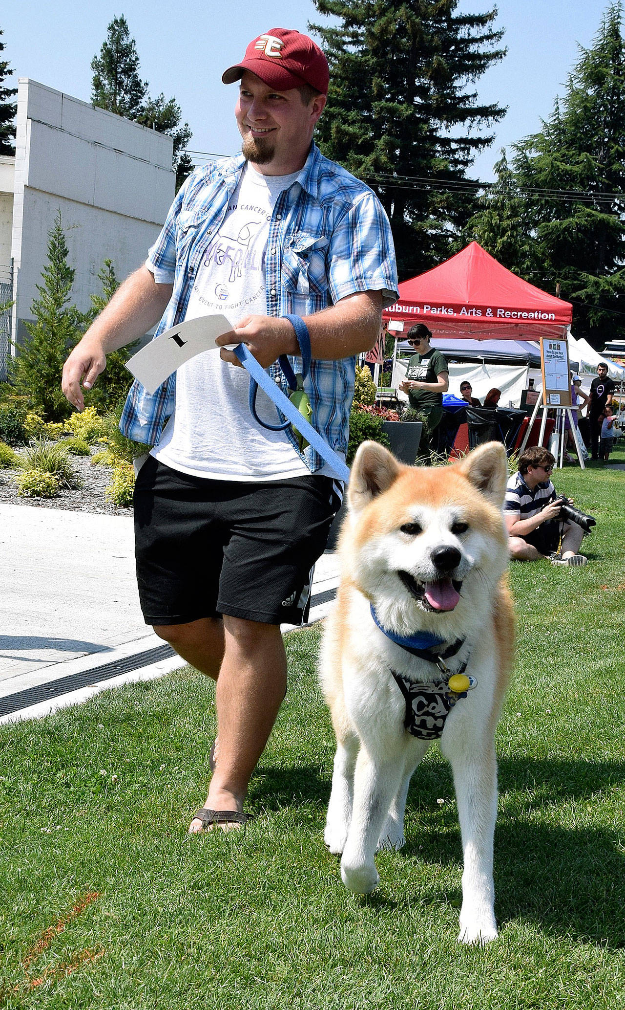 Joshua Drewry walks with his dog, Taiyo, winners in Best in Show. RACHEL CIAMPI, Auburn Reporter