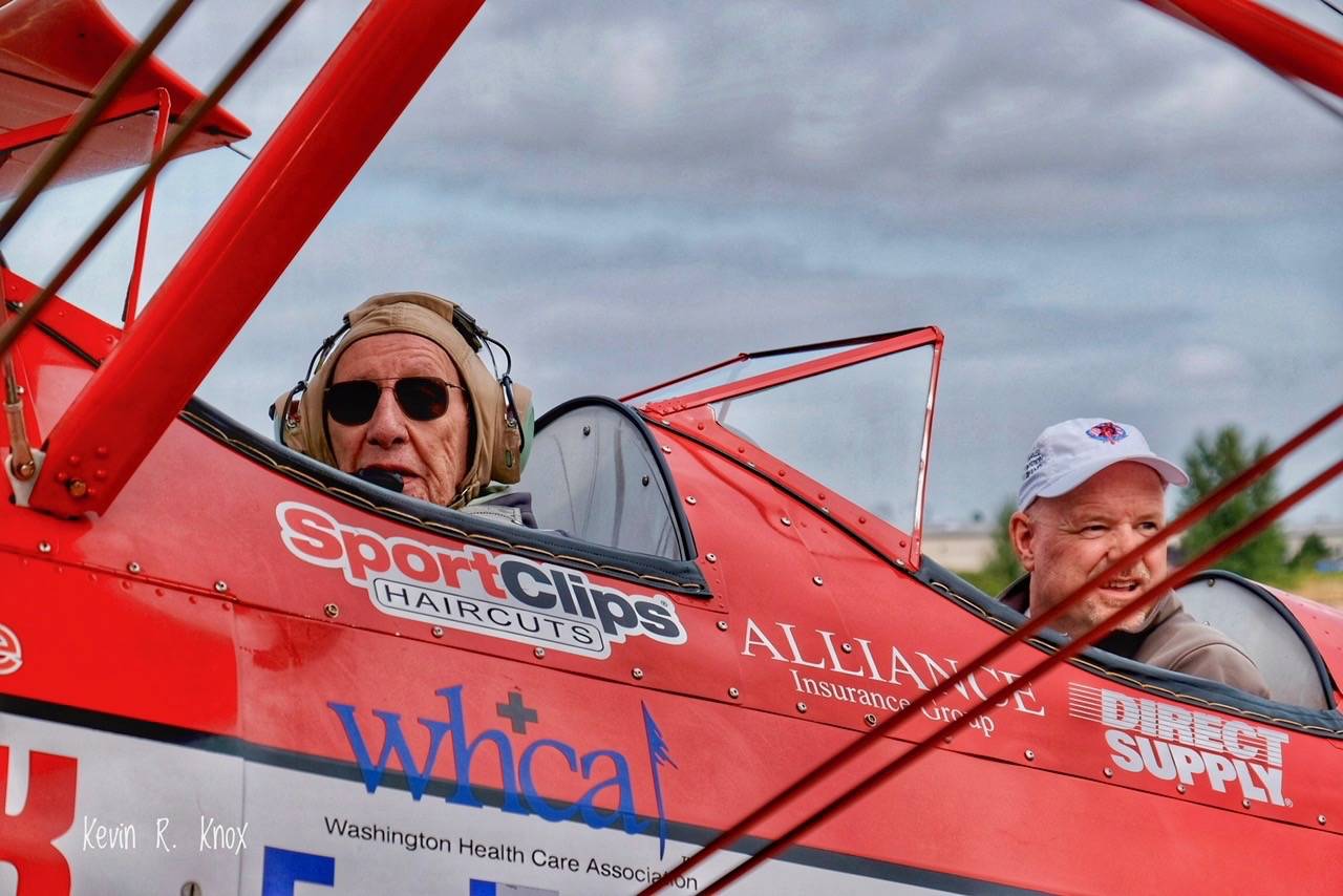 Roger Fenton, left, gets ready to take off from the Auburn Municipal Airpot in a 1942 Boeing Stearman military trainer plane piloted by Darryl Fisher. COURTESY PHOTO, Kevin R. Knox