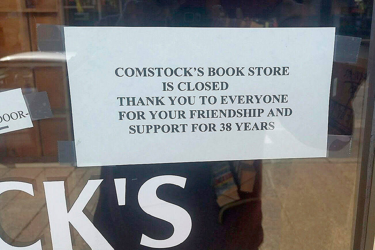 Customers who hope to enter Comstock’s Bookstore find this note. Comstock’s, a mainstay on Main Street, is no longer. ROBERT WHALE, Auburn Reporter