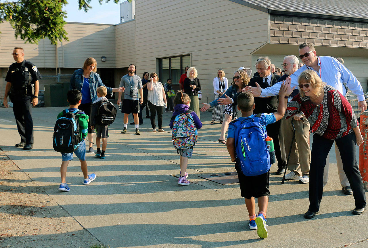 Pacific Mayor Leanne Guier and other representatives from the cities of Pacific and Algona greet students back to class at Alpac Elementary School on Sept. 5. COURTESY PHOTO