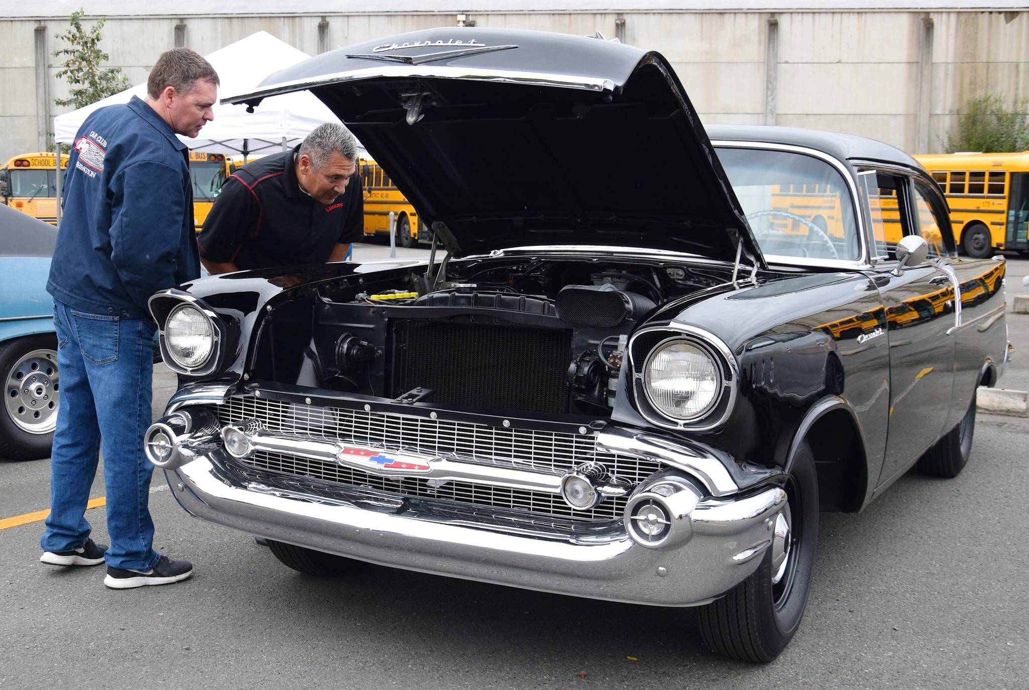 Rich Cerrillo and Chris Ralph inspect a classic 1957 Chevrolet during the Hot Rod Garage Car, Truck and Motorcycle Show on Saturday. RACHEL CIAMPI, Auburn Reporter