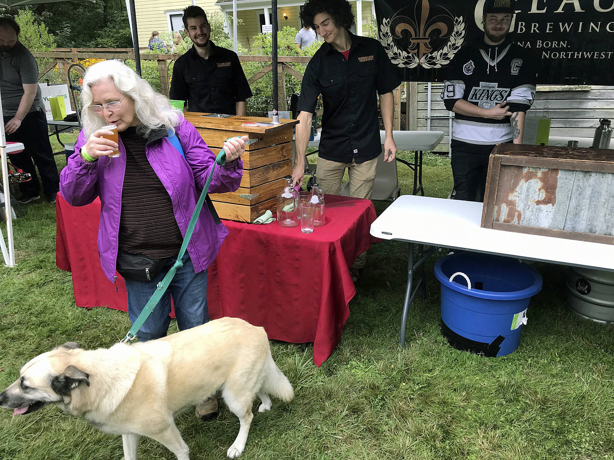 Auburn’s Geaux Brewing serves up a fresh, on-tap beer to a customer during the Hops & Crops Music and Beer Festival at Mary Olson Farm last Saturday. MARK KLAAS, Auburn Reporter