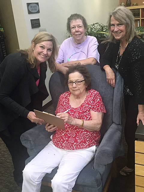 Radine Lozier, director of the Auburn Senior Activity Center, left, and staff members Michelle Young. seated, Connie Humphrey, standing center, and Carrie Stahlecker, right. COURTESY PHOTO