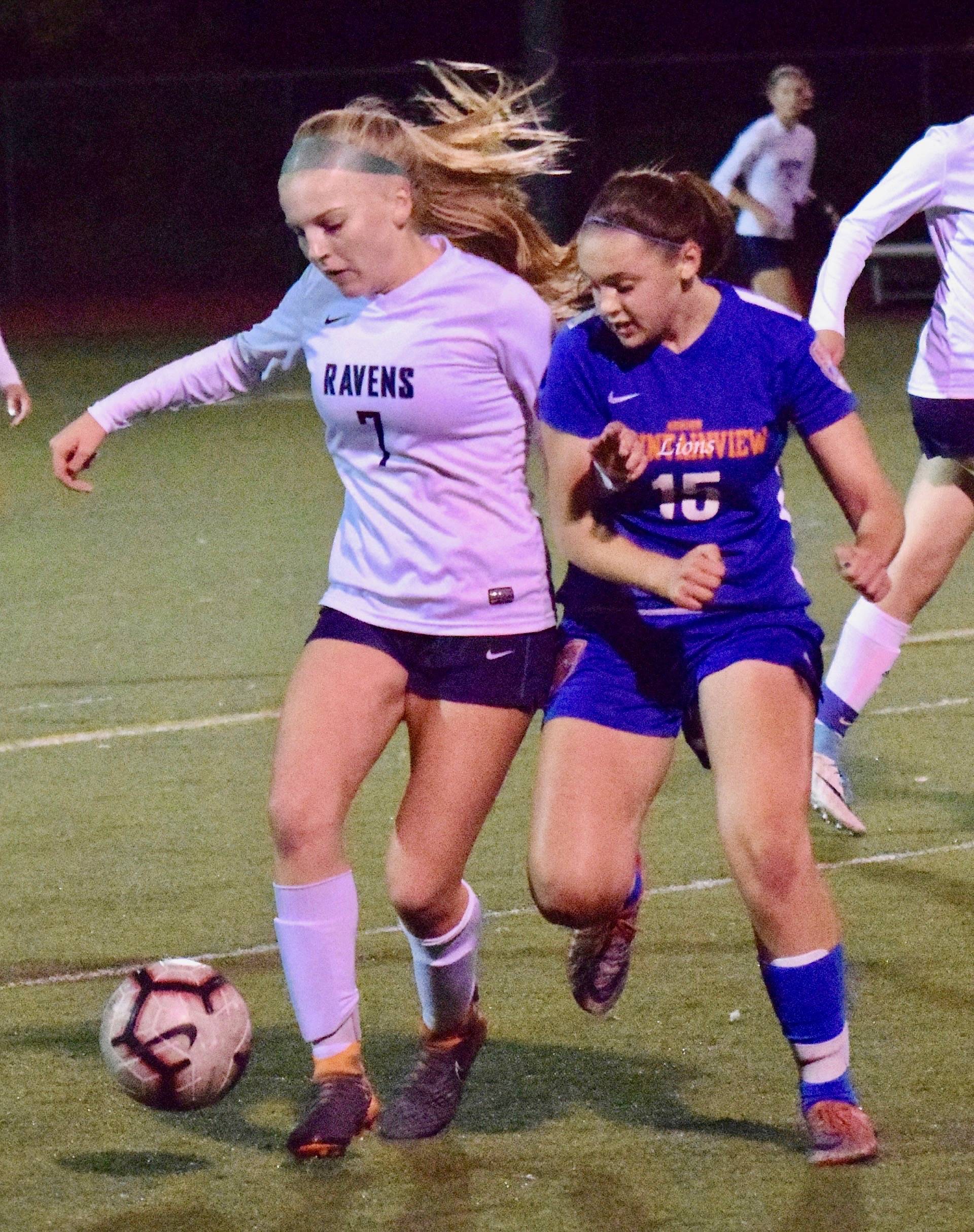 Auburn Riverside’s Kayla Rydberg, left, and Auburn Mountainview’s Elin Hires battle for the ball during NPSL girls soccer action Wednesday night. RACHEL CIAMPI, Auburn Riverside