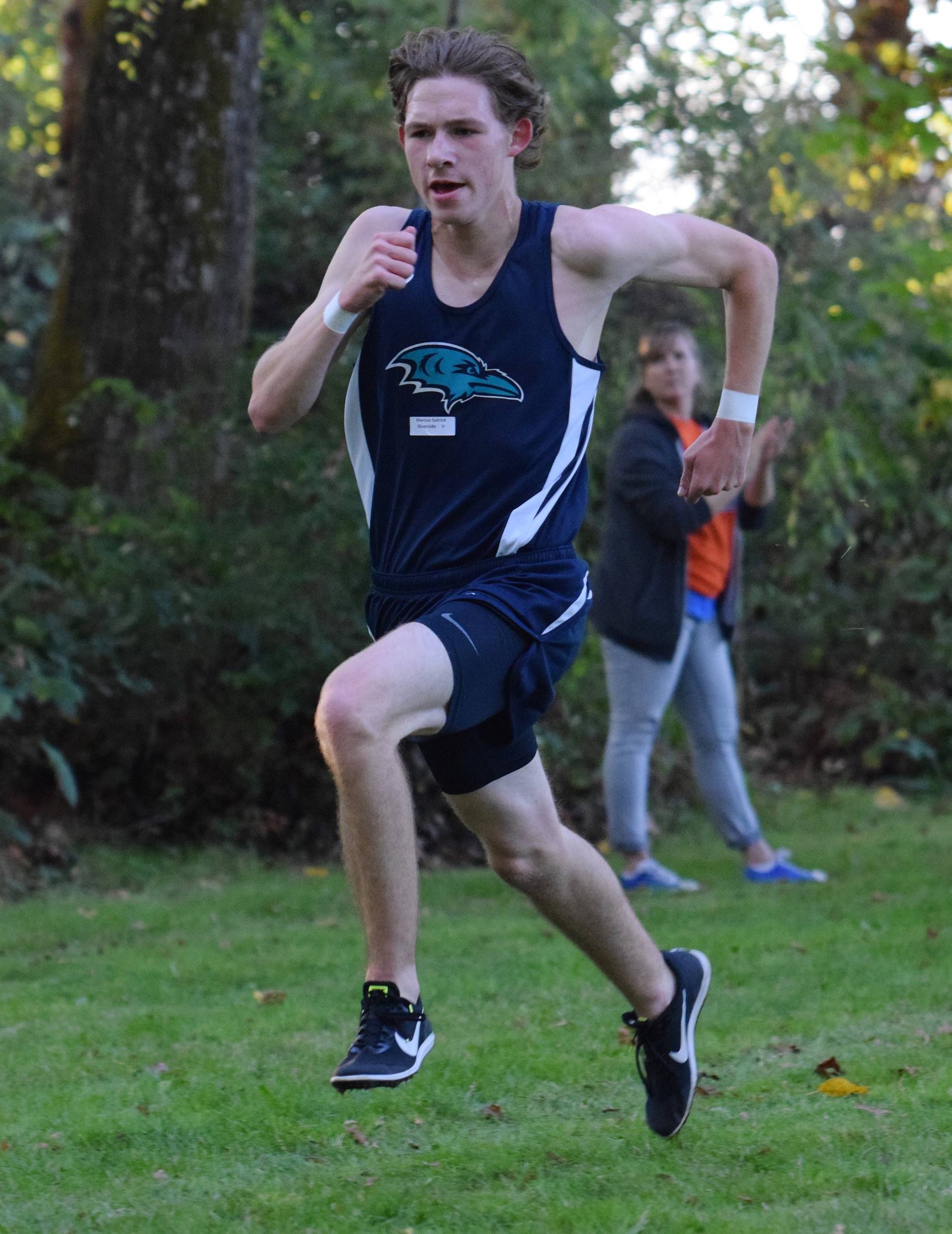 Auburn Riverside senior Marcus Sutrick dashes to a convincing victory at the all-city cross country meet at Isaac Evans Park on Wednesday afternoon. RACHEL CIAMPI, Auburn Reporter