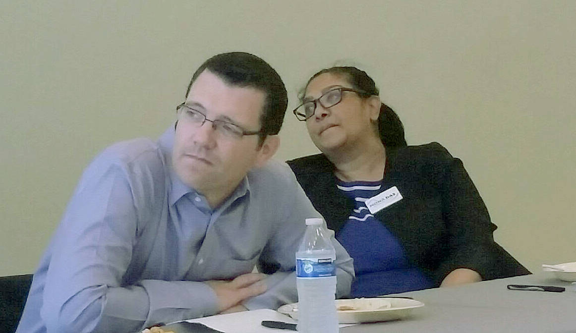 47th Legislative District state Sen. Joe Fain, R-Auburn, and his challenger, Mona Das, D-Covington, listen to other candidates for state office speaking Tuesday, Oct. 16, during a forum at the Auburn Community Event Center. ROBERT WHALE, Auburn Reporter