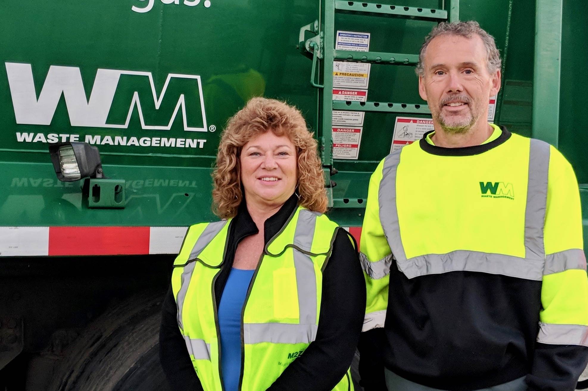 Mayor Nancy Backus recently joined Waste Management driver Mike Fingerson for a ride-along to help bring awareness to the fall food drive. COURTESY PHOTO, WM