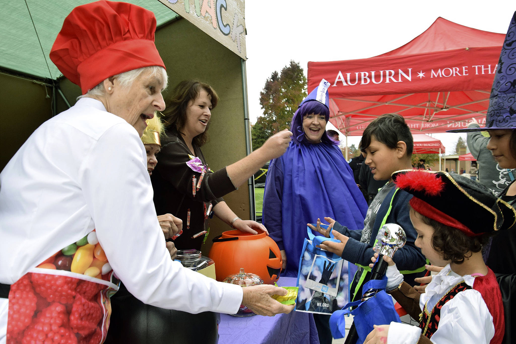 Auburn Police volunteers give out candy to trick-or-treaters at their sugar shack.