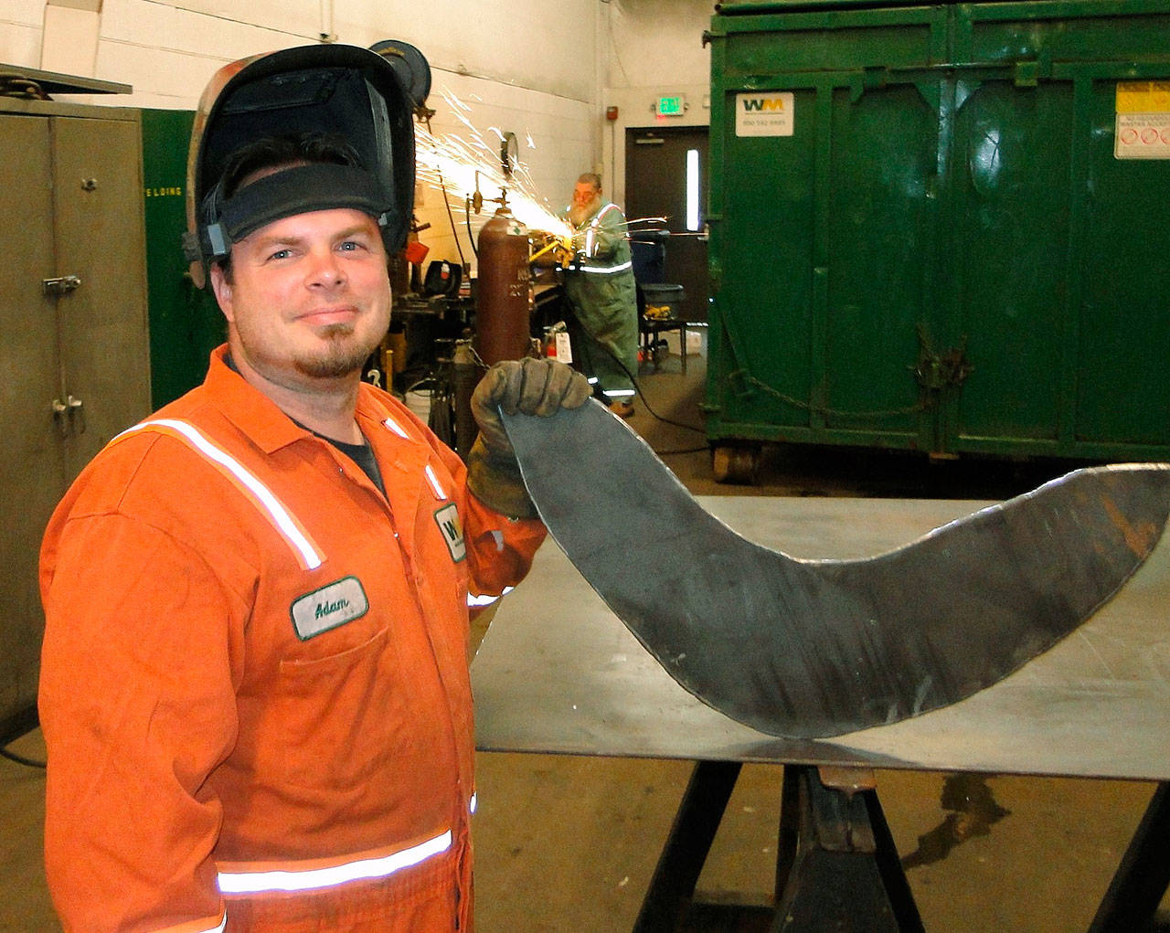 Auburn’s Adam Mitten, a Thomas Jefferson High School graduate and a former Marine, has found a home as a Waste Management technician. COURTESY PHOTO, WM