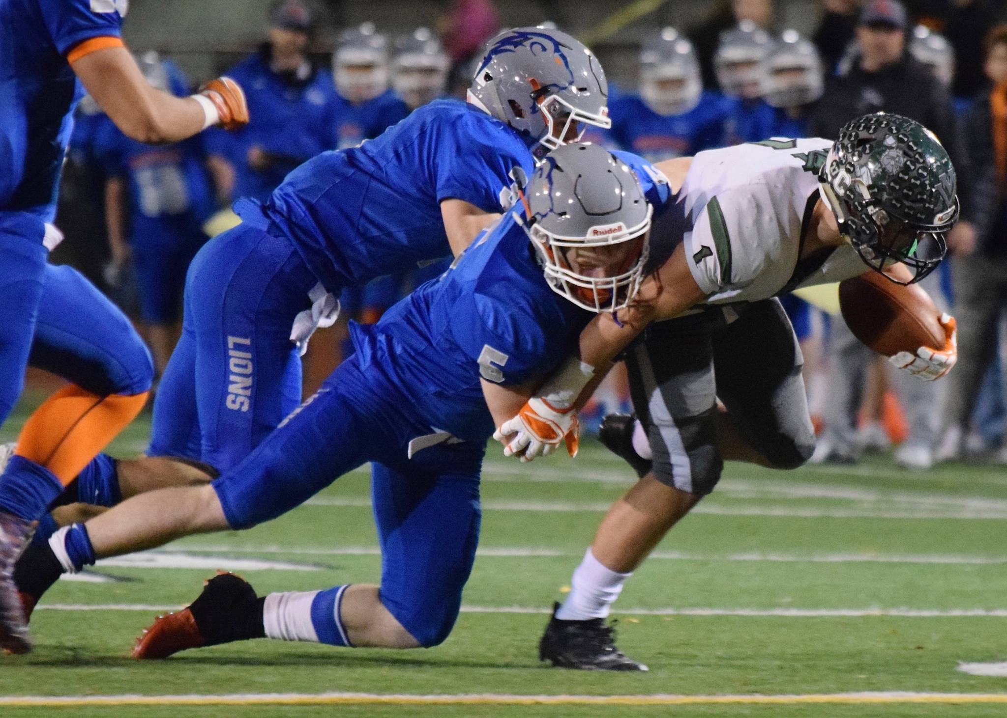 Auburn Moutainview’s Teagin Child (5) and Berkley Alfrey tackle Mount Vernon’s Landon Edwards during district playoff action Friday night. RACHEL CIAMPI, Auburn Reporter